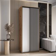 Schuifdeurkast Tharo 1,1 meter breed in wit/eiken, ook geschikt voor de woonkamer, anti-stofborstels, metalen handgrepen in zwart, 235,2 x 110 x 45 cm
