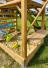 Spielturm inkl. Wellenrutsche aus Holz Natur Detailansicht Sandkasten 